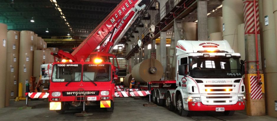 Todd McPhee Crane Hire 50T and Scania Transporter loading paper roll at Kinleith.